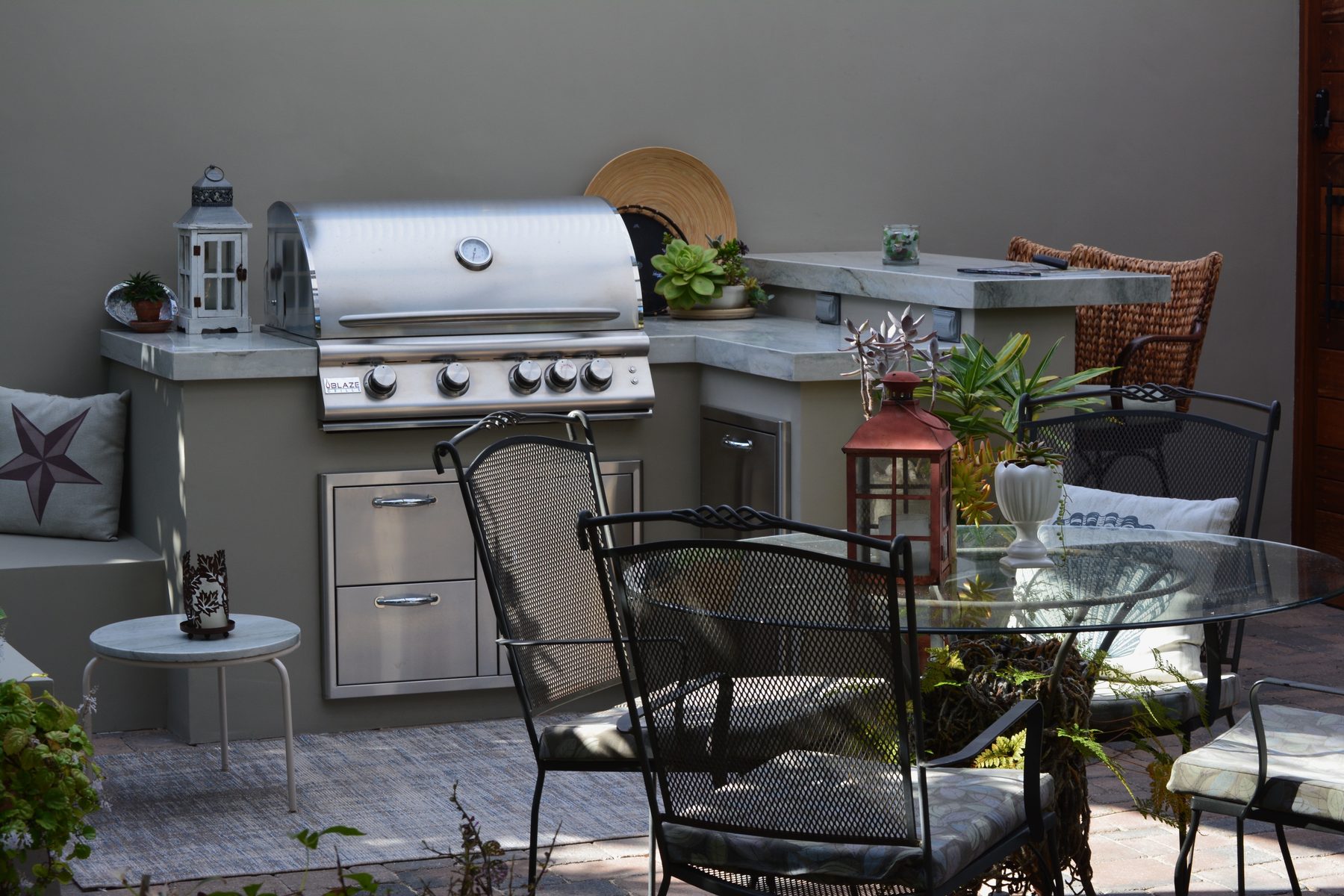Custom built-in BBQ island with stainless grill and stone counters